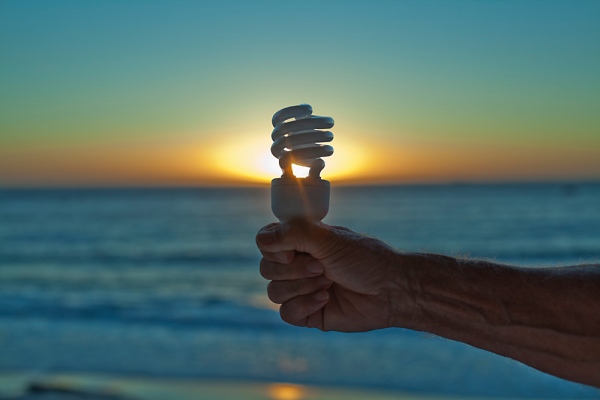  Hand Holding Lightbulb at Sunset,Cape Town,Western Cape,